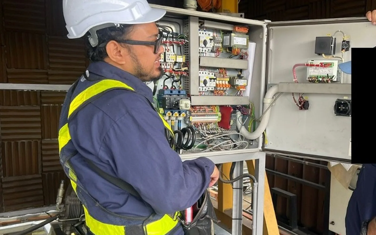 HAZS technician performing industrial maintenance on plant equipment