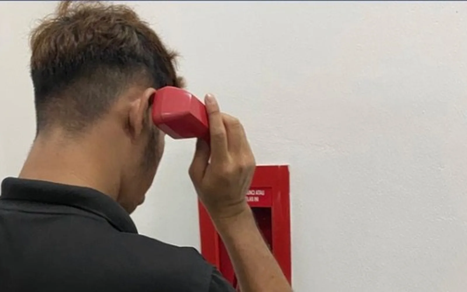 HAZS technician testing an intercom and public address handset